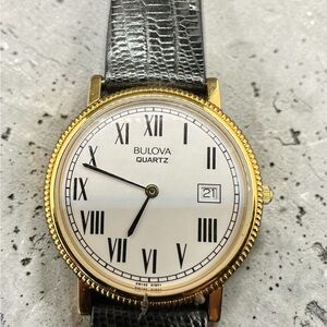 Bulova Gold and White Dress Watch with Black Strap. New old stock.